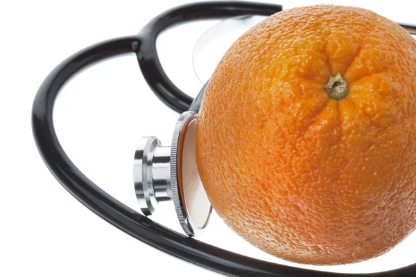 Close up shot of a orange with a stethoscope — Stock Photo, Image