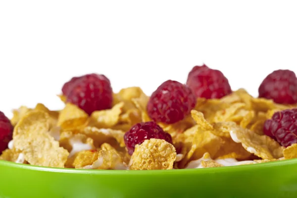 Corn flakes with raspberries — Stock Photo, Image