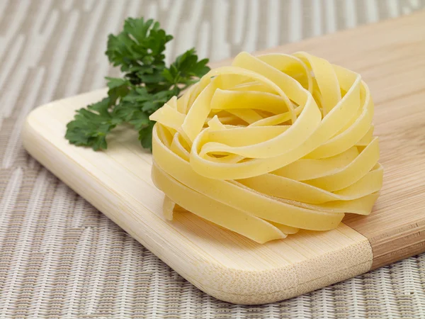 Dry tagiiatelle pasta — Stockfoto