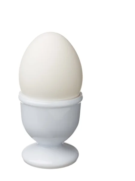 Egg with a egg cup displayed on white — Stock Photo, Image