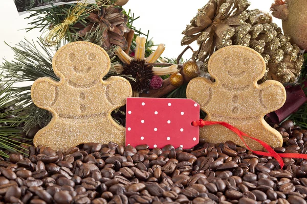 Gingerbread cookies and beans with tag — Stock Photo, Image