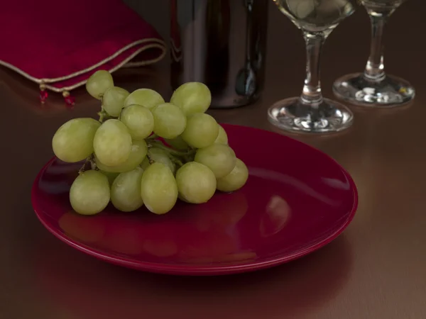 Зелений виноград в червоній тарілці — стокове фото