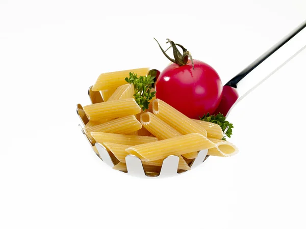 Ladle with penne and tomato — Stock Photo, Image