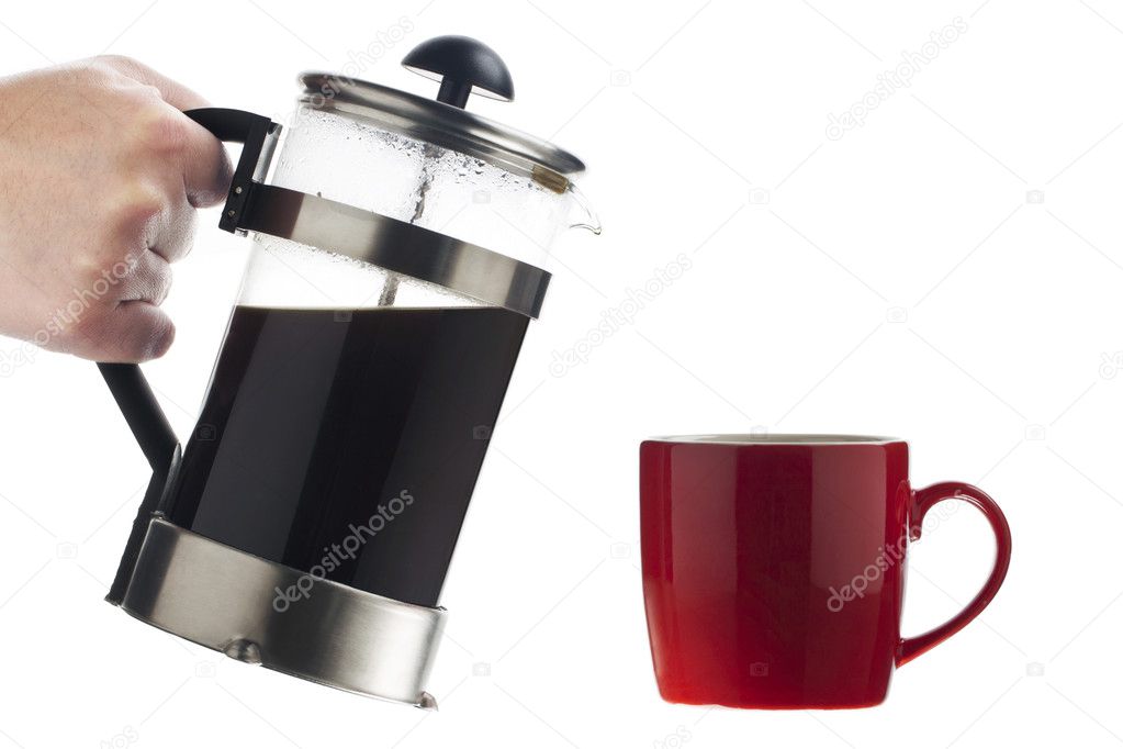 Human hand with a coffee pot serving coffee
