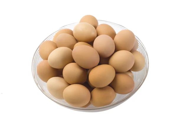 Stapel van bruin eieren op een kom — Stockfoto