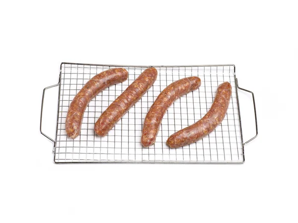 Sausages sitting on wire rack — Stock Photo, Image