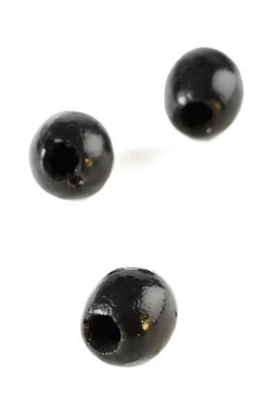 Three black olives — Stock Photo, Image