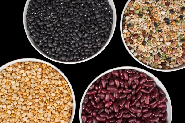 Variety of food grains in bowls — Stock Photo, Image