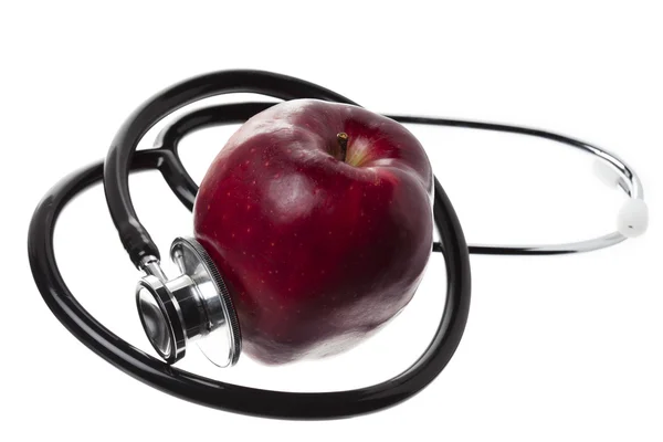 View of an apple displayed with a stethoscope — Stock Photo, Image