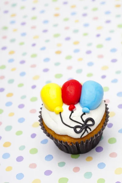 Top view of a cupcake with balloon design — Stock Photo, Image