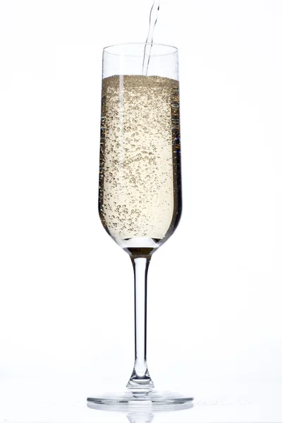 View of champagne falling in glass Stock Photo