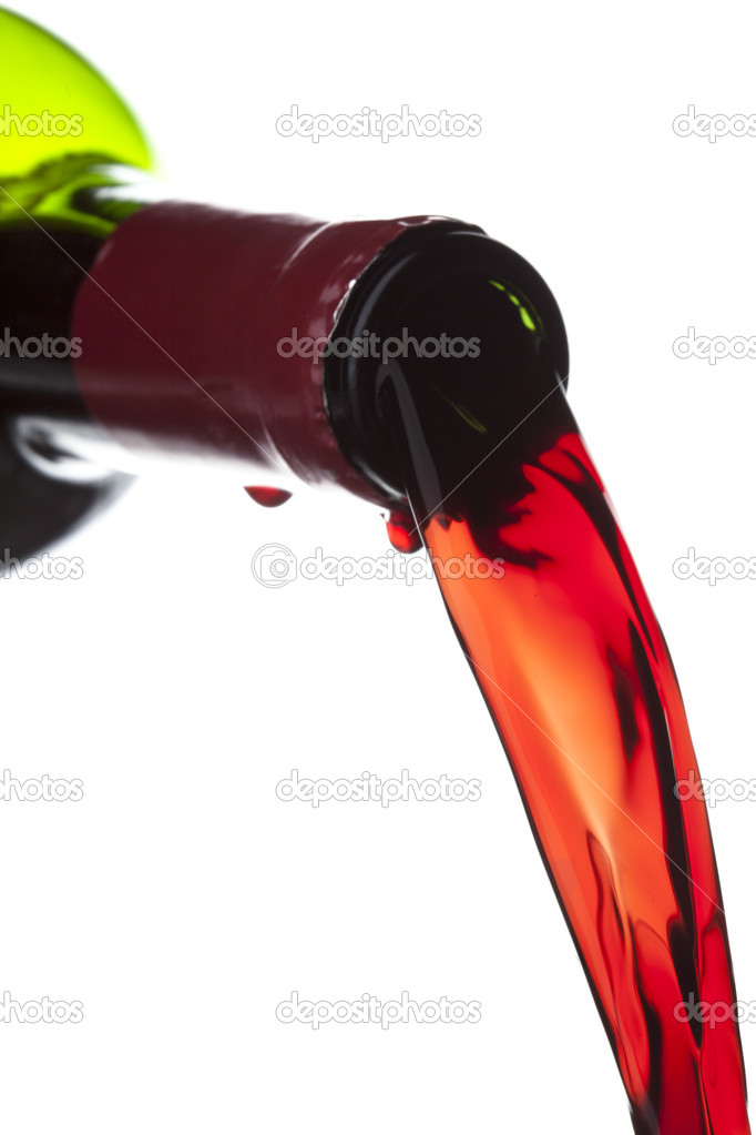 red wine pouring from bottle