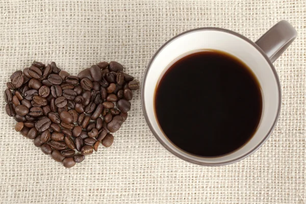 229 tasse de café avec grains de café — Photo
