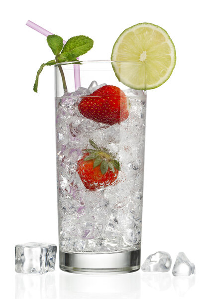 Glass of ice cubes and strawberries with decoration on top