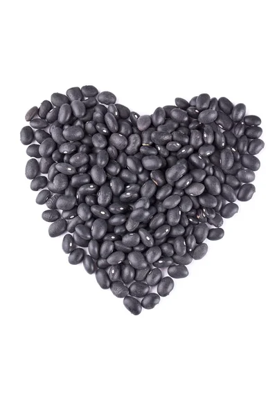 Heart shape made up of black beans — Stock Photo, Image