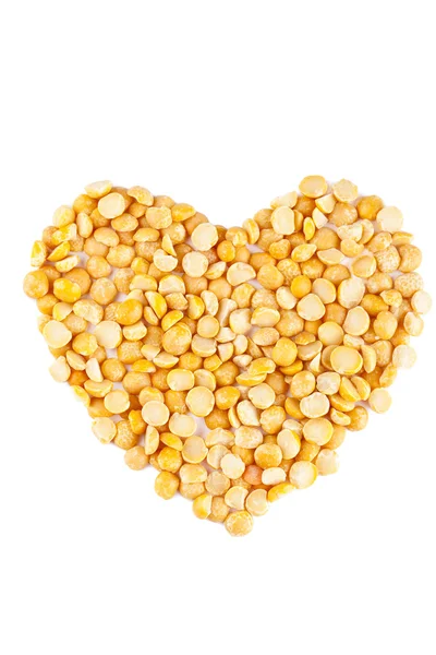 Heart shape yellow lentils — Stock Photo, Image