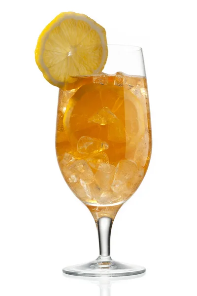 Orange juice in glass with slice on top — Stock Photo, Image