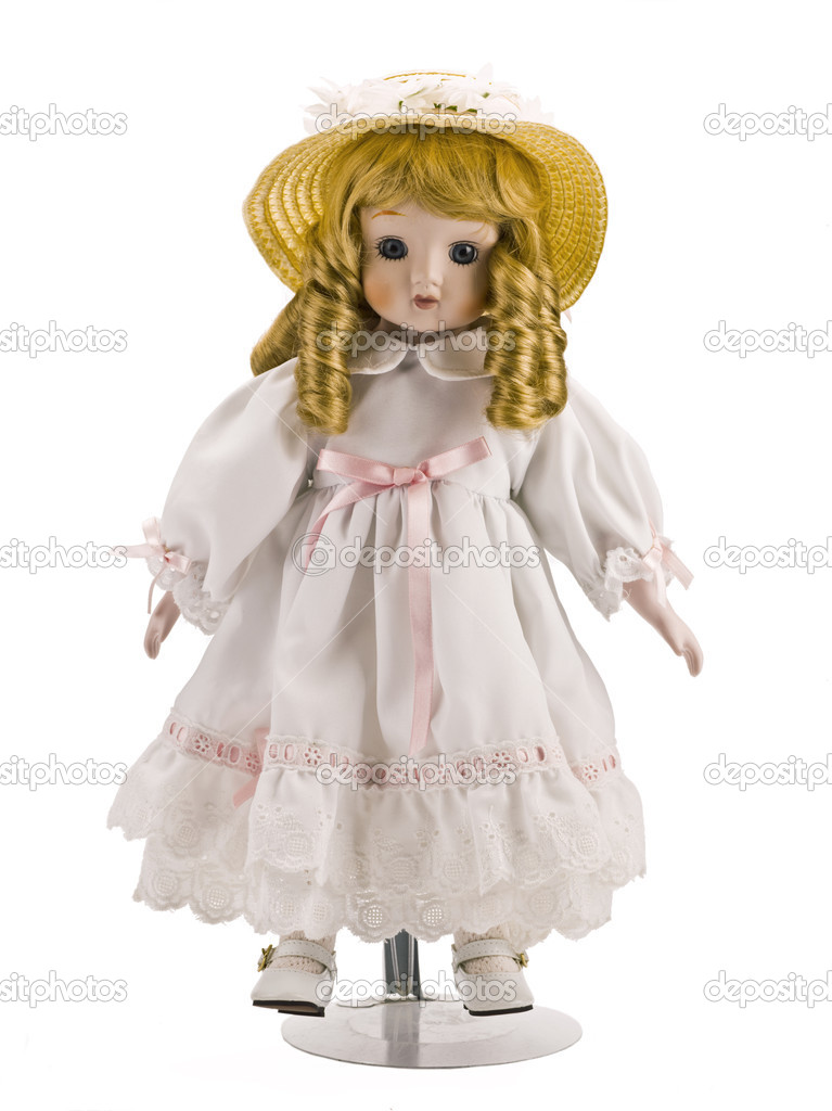 little doll on white dress and hat