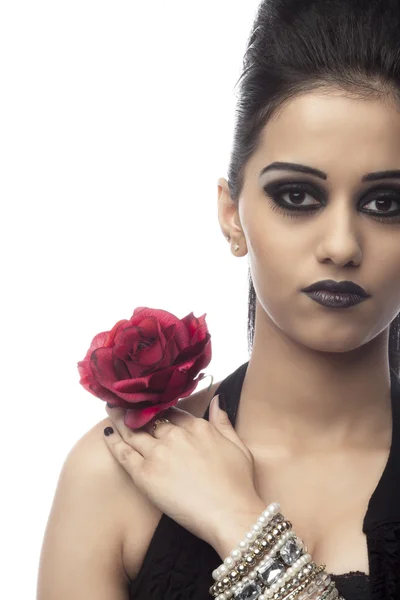 Beautiful indian woman holding rose — Stock Photo, Image