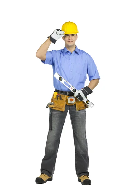 Pracownik budowlany trzyma poziom linijki — Zdjęcie stockowe