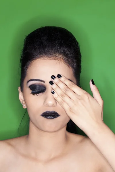 Beautiful young indian female fashion model covering her eye — Stock Photo, Image