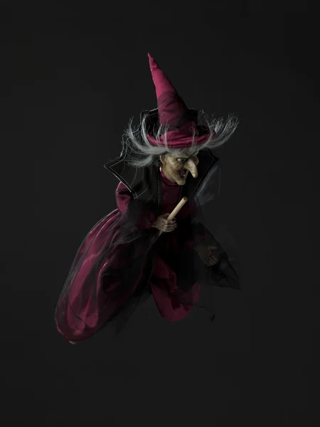 Vista de uma bruxa voando em sua vassoura — Fotografia de Stock