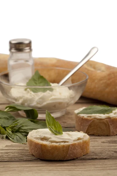 Baguette slice with butter spread — Stock Photo, Image