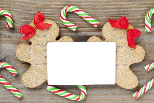 Close up image of blank placard arranged with gingerbread men an — Stock Photo, Image
