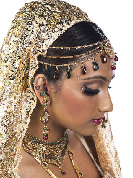 side view of a attractive female wearing bridal dress and jewelr
