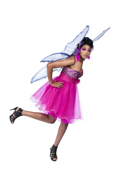 Side view of a young woman on one leg in fairy costume — Stock Photo, Image