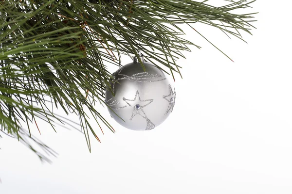 Star shape on silver christmas bauble hanging on christmas tree — ストック写真