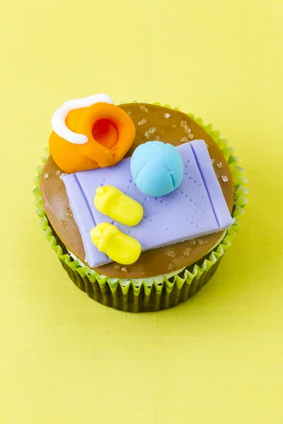 Tilt image of a cupcake with decorative miniature toppings — Stock Photo, Image