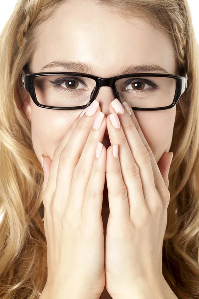 Woman with hand over her mouth — Stock Photo, Image