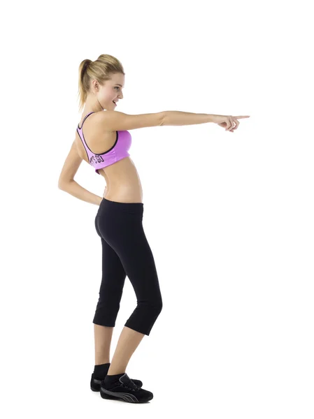 Young female in sportswear with hands raised — Stock Photo, Image