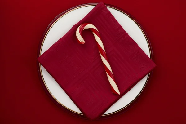 Candy cane on red background — Stock Photo, Image