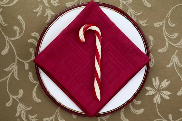 Candy cane with red table napkin — Stock Photo, Image