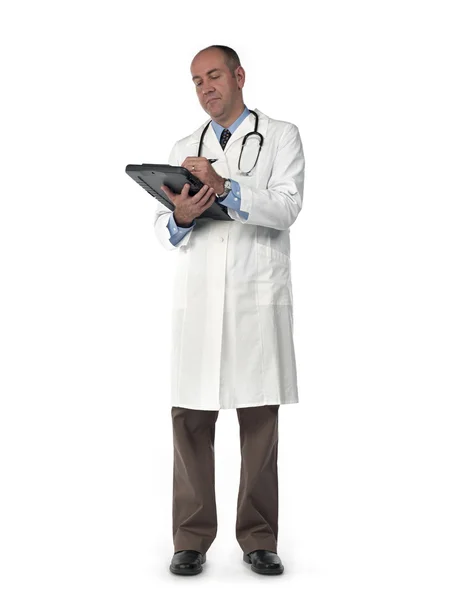 Mature doctor writing on his clipboard — Stock Photo, Image