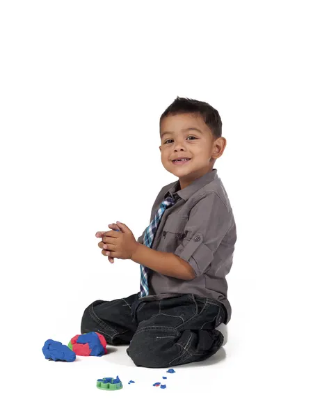 Smiling asian boy playing with play dough — Stock Photo, Image