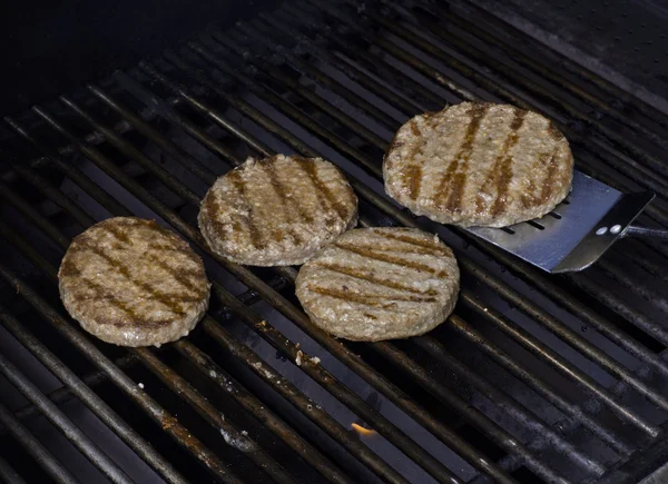 Grilling burger patties — Stock Photo, Image