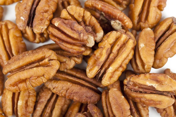 Högen av pecannötter närbild — Stockfoto