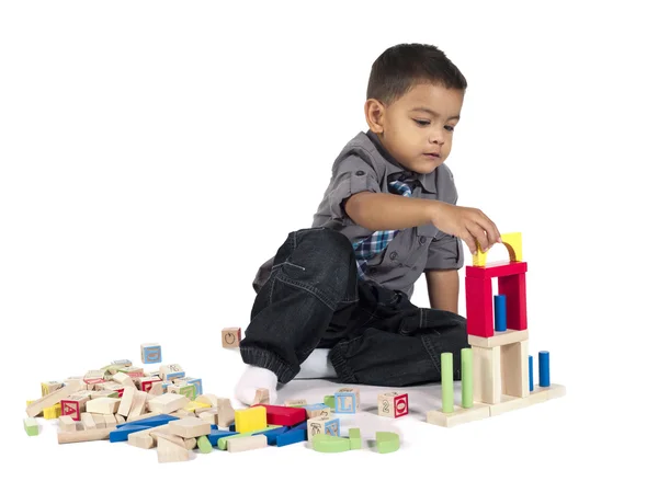 Innocent asian boy playing with building blocks — Stock Photo, Image