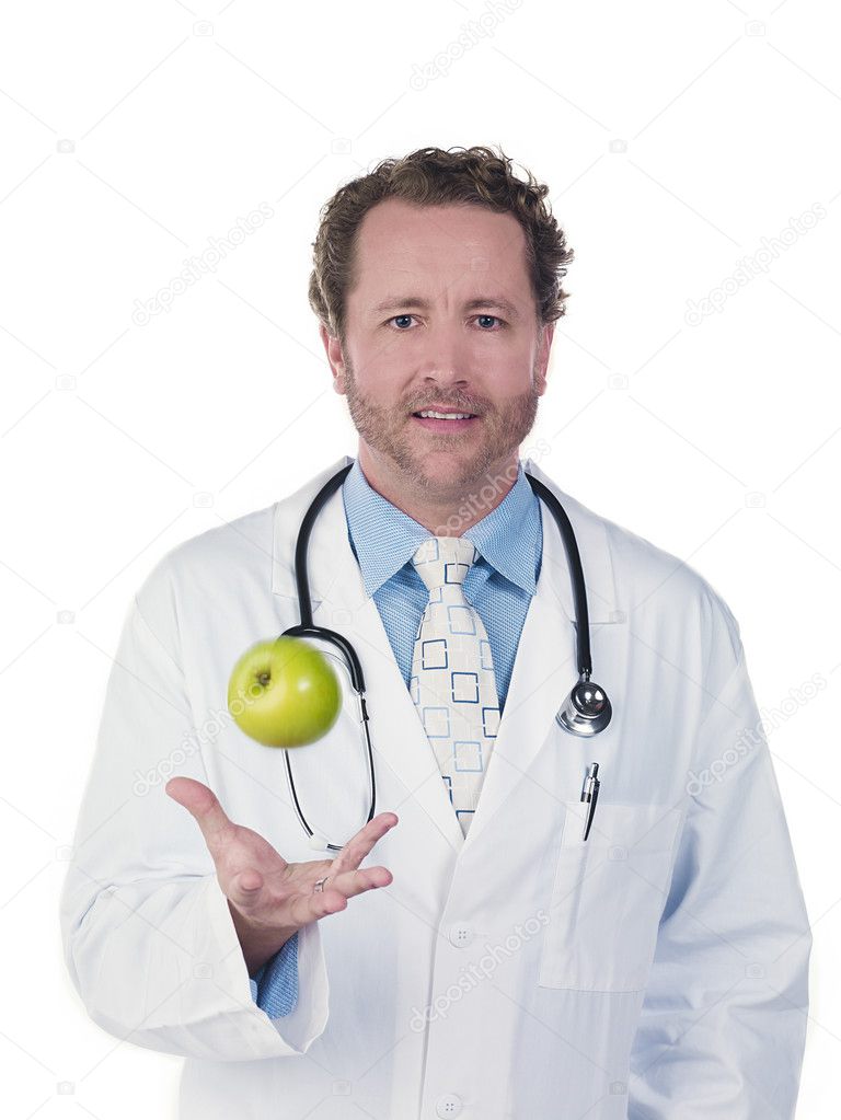 doctor tossing green apple