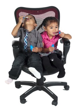 cute children playing with bubble wand