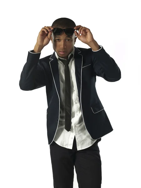 Portrait of a businessman adjusting sunglasses — Stock Photo, Image