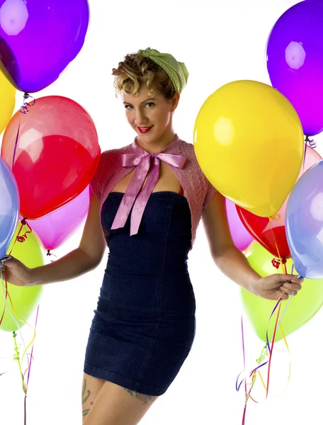 Mujer aferrándose a globos —  Fotos de Stock