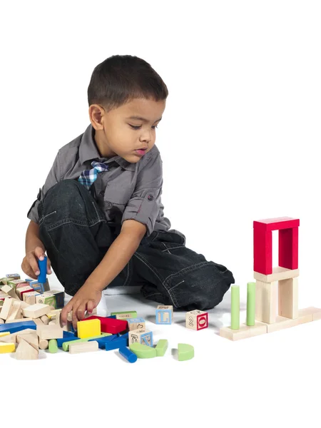 Boy playing with building blocks — Stock Photo, Image