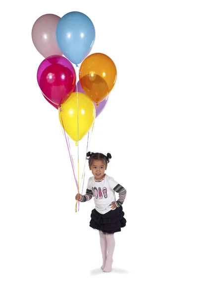 Cute little girl holding multicolored balloons — Stock Photo, Image