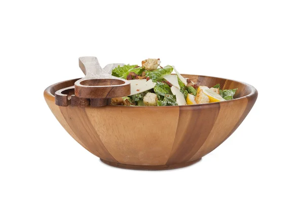 Ceasar salad in wooden bowl with utensils — Stock Photo, Image