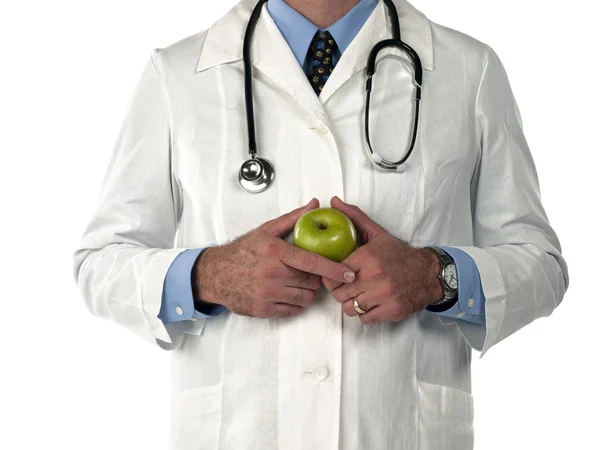 Cropped image of a doctor holding green apple — Stock Photo, Image