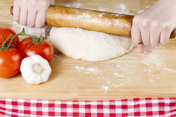 Rolling pin knead on dough — Stock Photo, Image